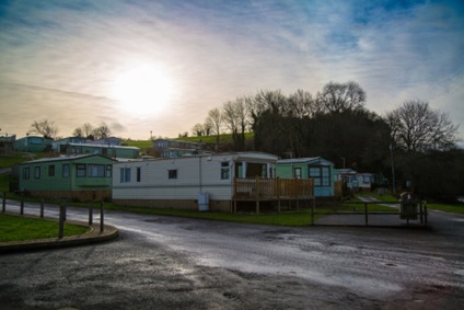 A group of mobile homes on a cloudy day